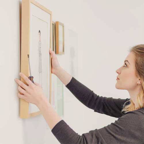 Lady-Hanging-Poster-Frame-Square-1 Lady-Hanging-Poster-Frame-Square-1